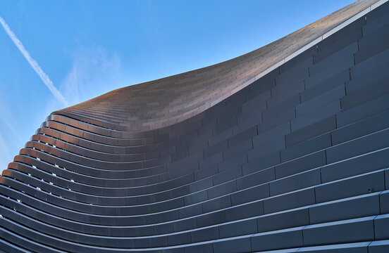 Madrid, Spain 06-07-2025: Sunset Reflections on the Metallic Facade of Santiago Bernab&eacute;u