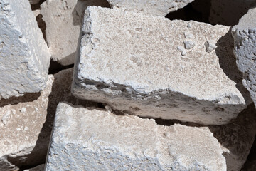 White concrete foundation blocks for construction, building materials and site preparation