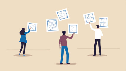 People arranging design sketches on the wall in a collaborative creative process environment setting up ideas