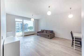 Modern Home Living Room with Large Window and Urban View