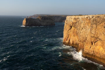 San Vicente Cape cliffs in the Algarve region of Portugal in a sunny day.