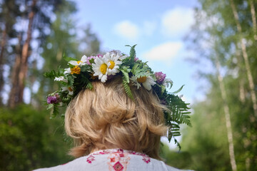Naklejka premium Girl in flower wreath. Summer Solstice Day, Midsummer,