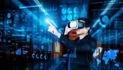 Businessman with headset standing at data center while analyzing financial data. Manager pointing...