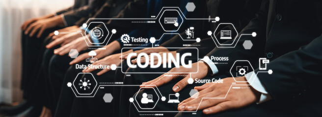 A group of professionals engaged in coding are depicted with a digital overlay highlighting key concepts in technology and software development, reflecting modern collaboration. Amity