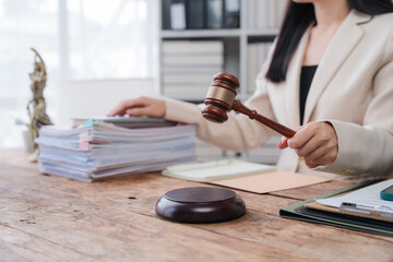 Female Lawyer with Gavel and Legal Documents