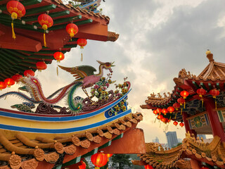 Traditional Chinese temple Thean Hou in Kuala Lumpur. View of the beautiful carved roof with...