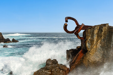 Fototapeta premium Sculptures of the wind fixed to the rocks of La Concha Bay, San Sebastian.