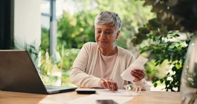 Senior woman, budget and writing on document, debt free and happy for savings on laptop. Receipt, counting and person in retirement for finance, investment and positive credit score in home backyard