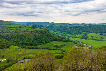 Fototapeta premium Landscape of the Maronne Valley under the clouds from Salers