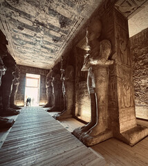 Interior view with giant statues of Ramses II Abu Simbel temple, ancient Egypt