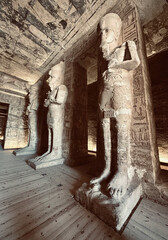 Interior view with giant statues of Ramses II Abu Simbel temple, ancient Egypt