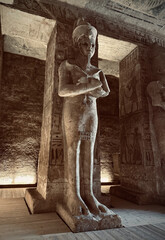 Interior view with giant statues of Ramses II Abu Simbel temple, ancient Egypt