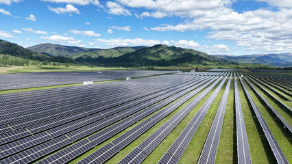 Solar power plant in the mountains. Thousands of solar panels. Renewable energy in remote...