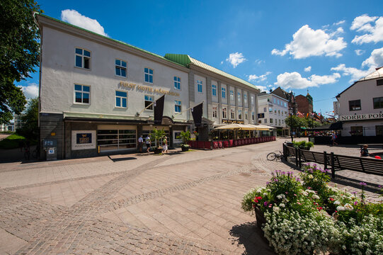 Halmstad, Sweden - July 18 2010: Historic hotel building with street cafe.