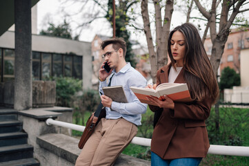 Business colleagues working outdoors, managing tasks and communicating effectively