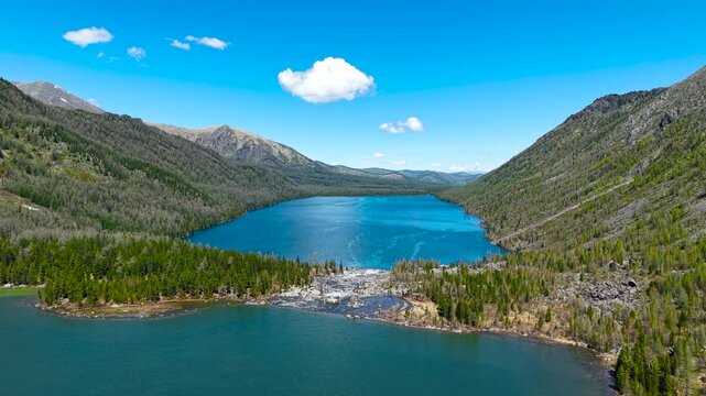 Multinsky lakes of the Altai Republic. Beautiful high-mountain lakes surrounded by mountains, cinematic 4k views from a great height.