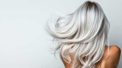 Naklejka premium A mesmerizing view of long, flowing hair swaying gently in the breeze, highlighting movement and beauty, ideal for showcasing hair care products and fashion themes.