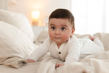 Bedtime. Cute little baby on bed at home