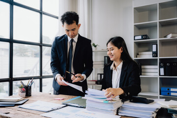 Business Professionals Reviewing Documents in Office