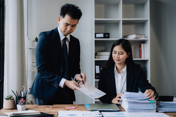 Business Professionals Reviewing Documents in Office