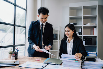 Business Professionals Reviewing Documents in Office