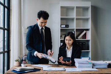 Business Professionals Analyzing Financial Data in Office