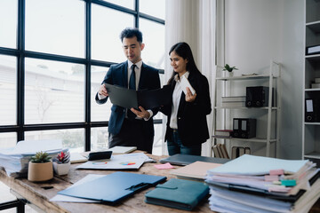 Business Professionals Reviewing Documents in Office