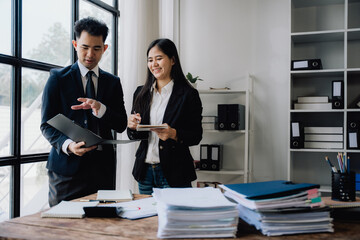 Asian Business Professionals Collaborating in Office