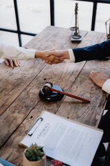 Legal Agreement Handshake on Wooden Table
