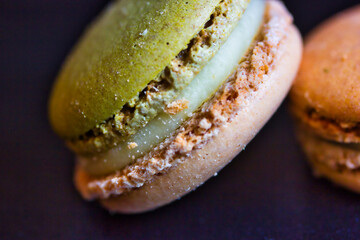 Close up photography of isolated macaron: diagonal macro, with details of crime and meringue.