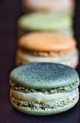 Row of macarons of different colors: splendid macro picture with different focus.