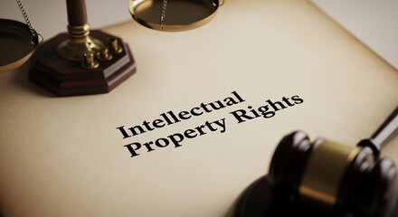 Close-up of scales of justice, gavel, and document with "Intellectual Property Rights" text, symbolizing legal protection and enforcement of intellectual assets