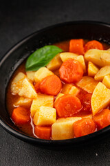 Stewed potatoes with carrots vegetarian side dish fresh delicious gourmet food background on the table rustic food top view copy space keto and paleo diet vegan food
