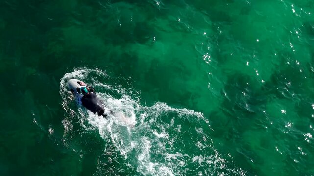 Riding an underwater scooter. Riding in the sea on a modern tugboat. Modern means of entertainment during a yacht vacation. View from a drone