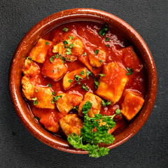 Butter chicken curry poultry meat tomato sauce dish fresh tasty gourmet food background on the table rustic food top view copy space