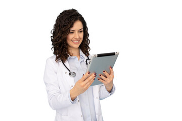 Medical professional reviewing patient data on tablet, wearing white lab coat and stethoscope