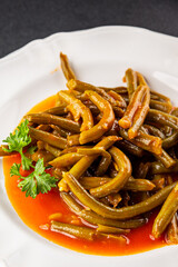 Green beans tomato sauce fresh delicious gourmet food background on the table rustic food top view copy space keto and paleo diet vegetarian and vegan food