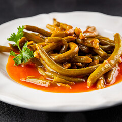 Green beans tomato sauce fresh delicious gourmet food background on the table rustic food top view copy space keto and paleo diet vegetarian and vegan food