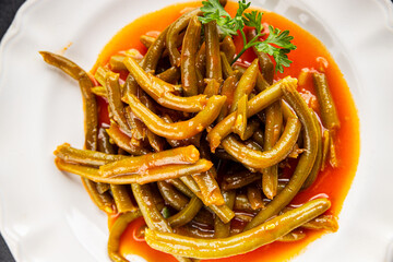 Green beans tomato sauce fresh delicious gourmet food background on the table rustic food top view copy space keto and paleo diet vegetarian and vegan food