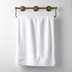 White Cotton Towel on Brass Wall Mounted Rack