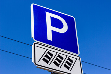 Parking Sign Indicating Available Spaces in a City With Clear Blue Sky in the Background at Midday