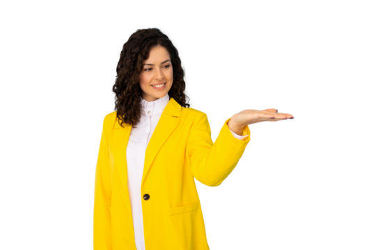 Young businesswoman with curly hair and yellow jacket smiling and holding something on transparent background