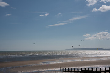 windsurfers on the beach and sea