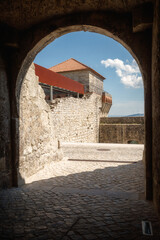 View of one of the turrets through the entrance gate of the Palace of the Counts in the castle of Ourém in Portugal.