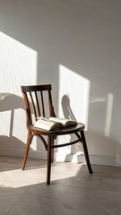 Wooden Chair with Open Book in Sunlit Room