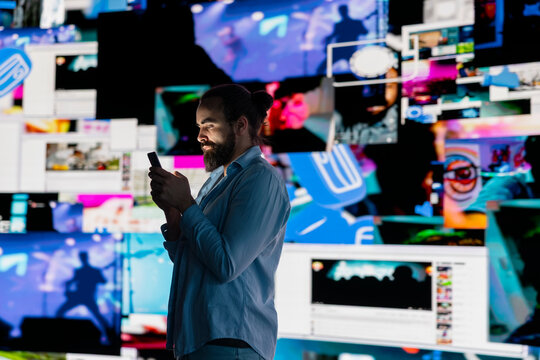 Smartphone user addicted by social media content consumption and obsessive doomscrolling that can trigger anxiety and harmful self esteem issues in the digital world. Overuse isolation.