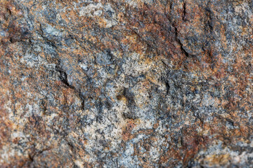 Natural stone slate in gray and brown colors. Rock or stone background design texture