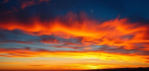 Obraz premium Fiery sunset, vibrant blue and orange cloudscape, dramatic light, breathtaking, majestic