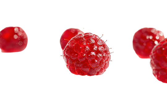 Juicy raspberries, red, isolated against a black background