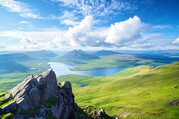 Views of Ben More Coigach, Loch Lurgainn and Loch Bad a Ghaill from the summit of Stac Pollaidh in the Scottish Highlands on a sunny summers day in the UK

